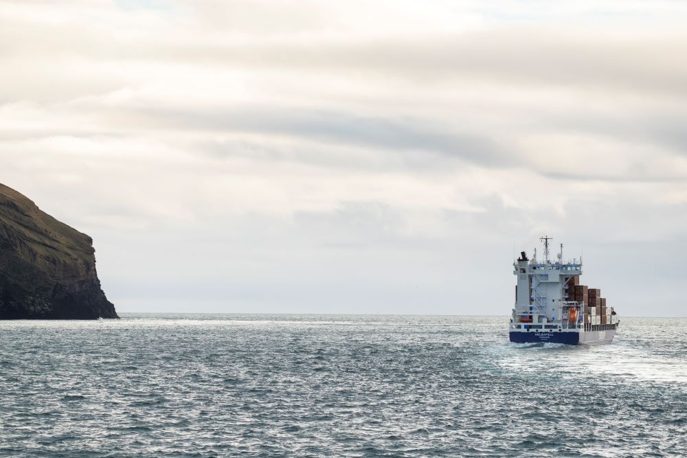Fishing boat heading out into the open water
